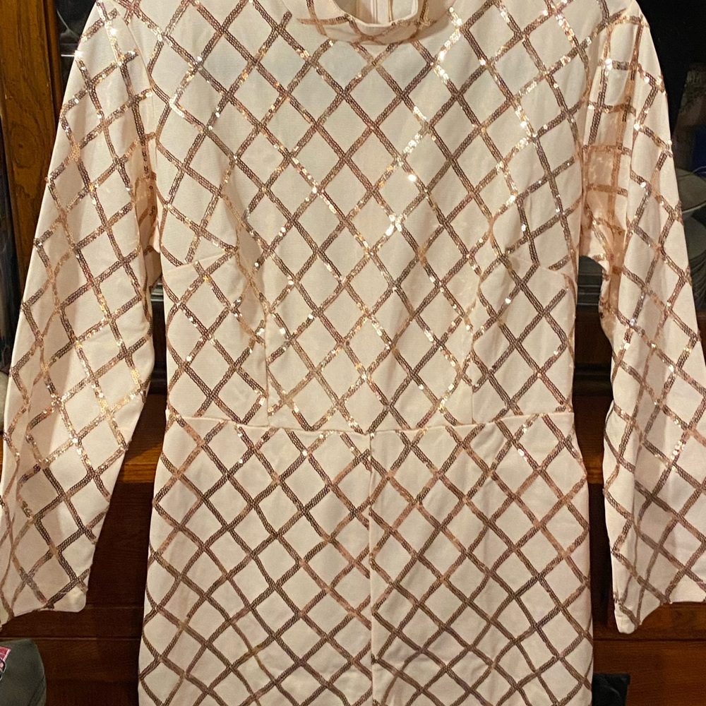 Blush and rose gold sequined long sleeved romper.